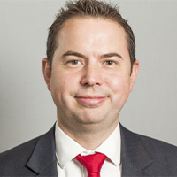 Headshot of Leigh Malyon smiling